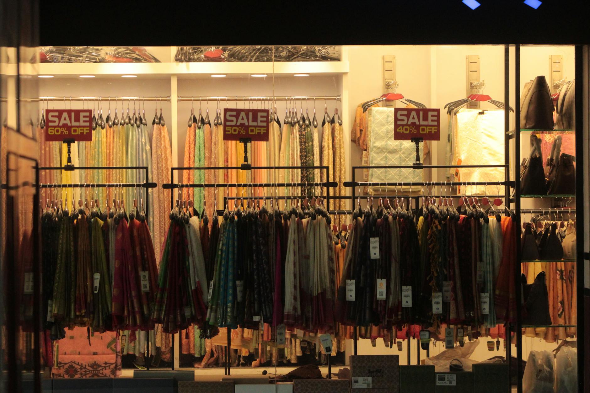 colorful clothing store display with sale signs Resale store front future store foreshadowing