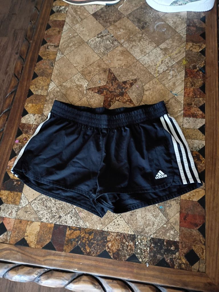 Showing the item I sold on Depop which is a pair of Adidas shorts.